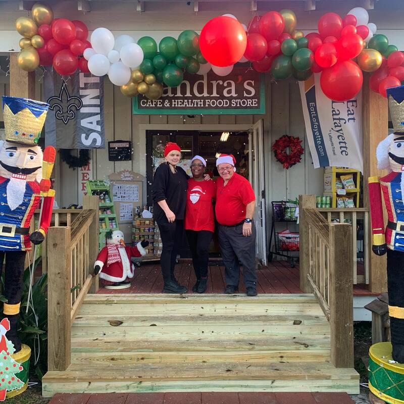 sandra's cafe and healthy marketplace storefront with bryan darlene and crystal